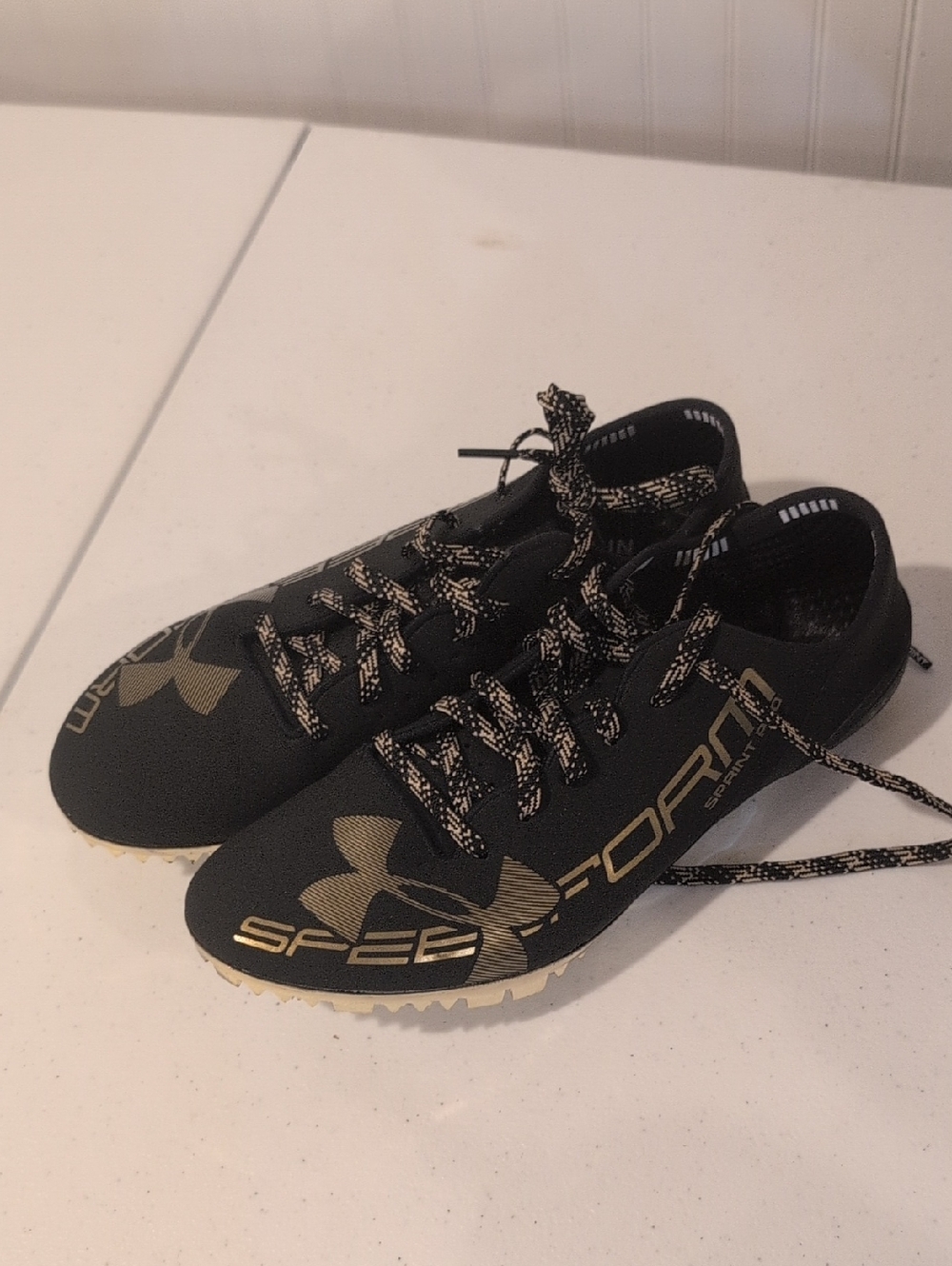 Under Armour Men’s Black & Gold Speedform Athletic Shoes